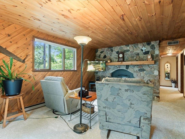 5863 Foley Rd, Baxter, MN 56425 - living room featuring carpet floors, wooden ceiling, a baseboard heating unit, wooden walls, and a stone fireplace