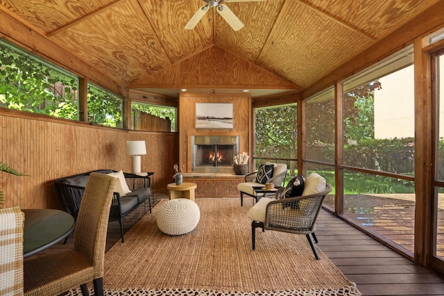1241 Cedar Lake Rd S, Minneapolis, MN 55416 - sunroom featuring a large fireplace, a ceiling fan, and lofted ceiling