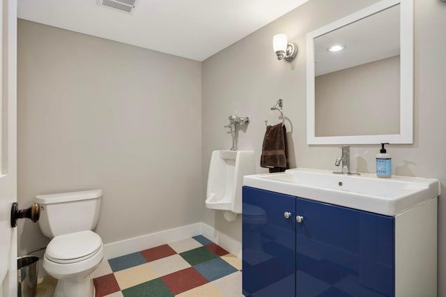 1241 Cedar Lake Rd S, Minneapolis, MN 55416 - half bath with toilet, tile patterned floors, vanity, and baseboards