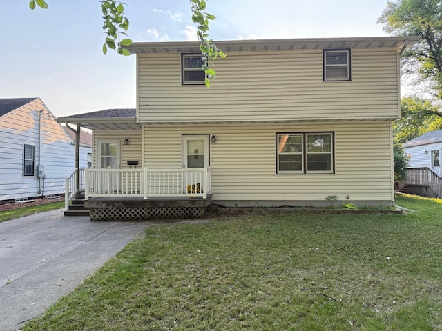 1618 10th St N, Fargo, ND 58102 - rear view of property with a lawn and a porch
