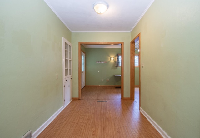 1618 10th St N, Fargo, ND 58102 - hall featuring wood finished floors, crown molding, and baseboards
