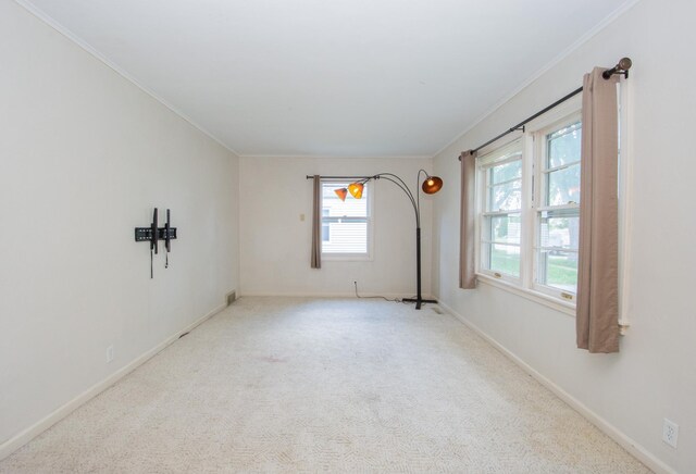 1618 10th St N, Fargo, ND 58102 - carpeted spare room with crown molding and baseboards