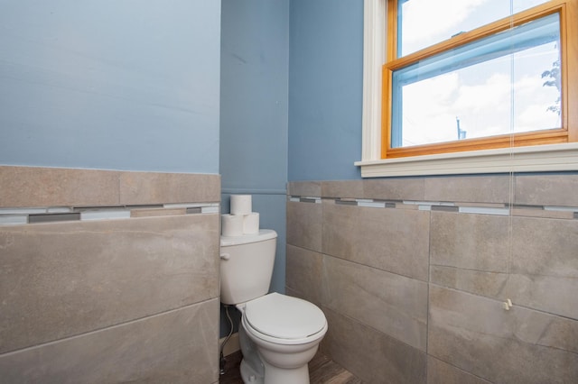 1618 10th St N, Fargo, ND 58102 - half bath with toilet, tile walls, and wood finished floors