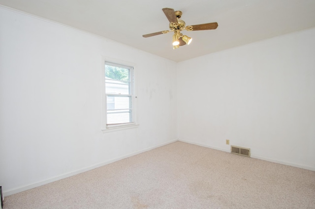 1618 10th St N, Fargo, ND 58102 - unfurnished room featuring carpet floors, ornamental molding, baseboards, and a ceiling fan