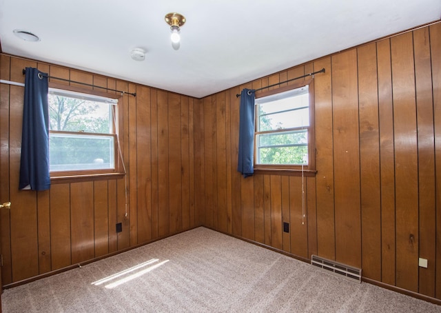1618 10th St N, Fargo, ND 58102 - spare room featuring carpet flooring, wood walls, and a smoke detector