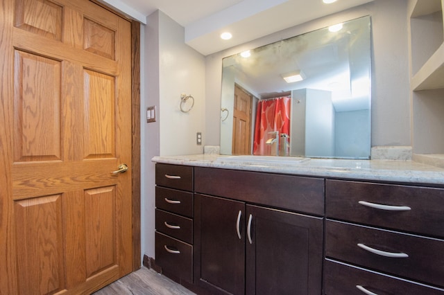 1618 10th St N, Fargo, ND 58102 - full bathroom with vanity and wood finished floors