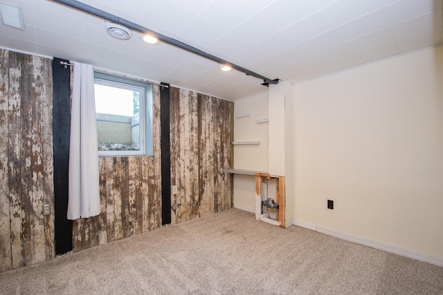 1618 10th St N, Fargo, ND 58102 - basement featuring carpet and wooden walls