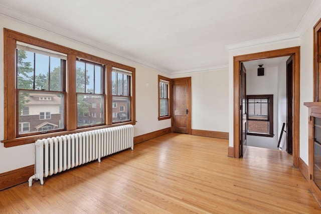 1601 Charles Ave, Saint Paul, MN 55104 - unfurnished room with radiator, light wood-style floors, and ornamental molding