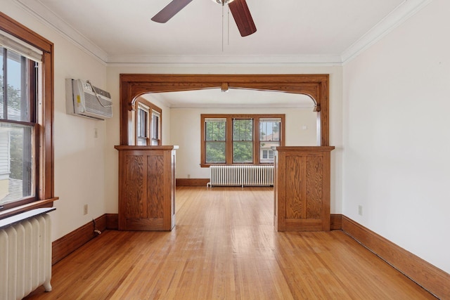 1601 Charles Ave, Saint Paul, MN 55104 - hall with radiator heating unit, an AC wall unit, light wood-style floors, and crown molding