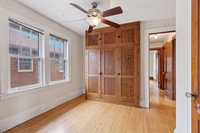 1601 Charles Ave, Saint Paul, MN 55104 - unfurnished bedroom with light wood-style floors and a ceiling fan