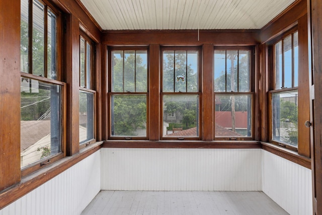 1601 Charles Ave, Saint Paul, MN 55104 - unfurnished sunroom featuring wood walls, wooden ceiling, and wood finished floors