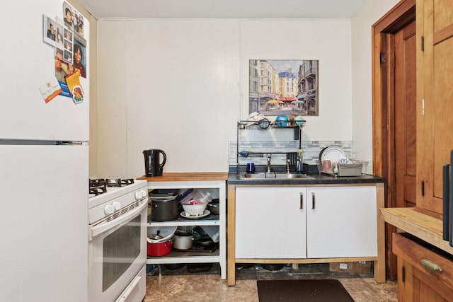 1601 Charles Ave, Saint Paul, MN 55104 - kitchen featuring white appliances, decorative backsplash, dark countertops, and white cabinetry