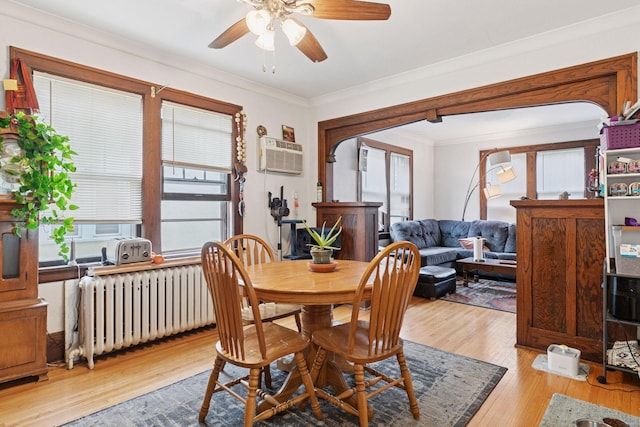 1601 Charles Ave, Saint Paul, MN 55104 - dining area featuring radiator, healthy amount of natural light, hardwood / wood-style floors, a ceiling fan, and ornamental molding