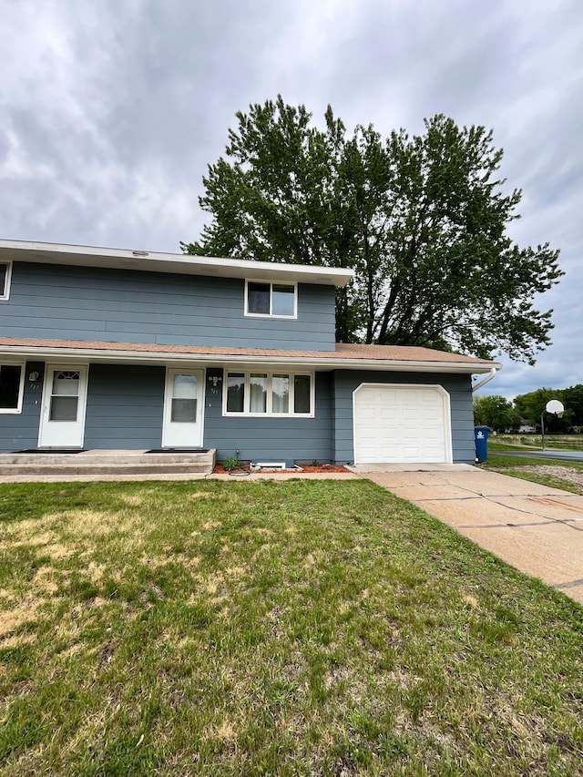 715 Circle Dr, Champlin, MN 55316 - view of front of property featuring an attached garage, a front lawn, and concrete driveway