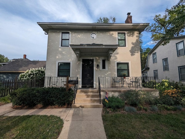 3109 James Ave S, Minneapolis, MN 55408 - view of front of house with a chimney, stucco siding, and a porch