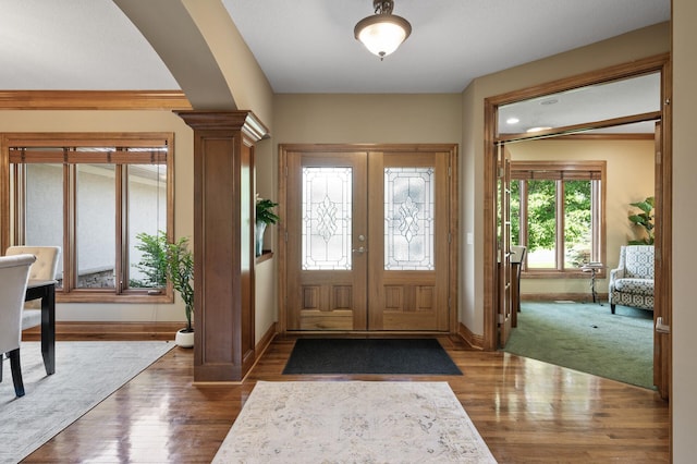 8867 Aviary Path, Inver Grove Heights, MN 55077 - foyer featuring baseboards, dark wood-type flooring, and arched walkways