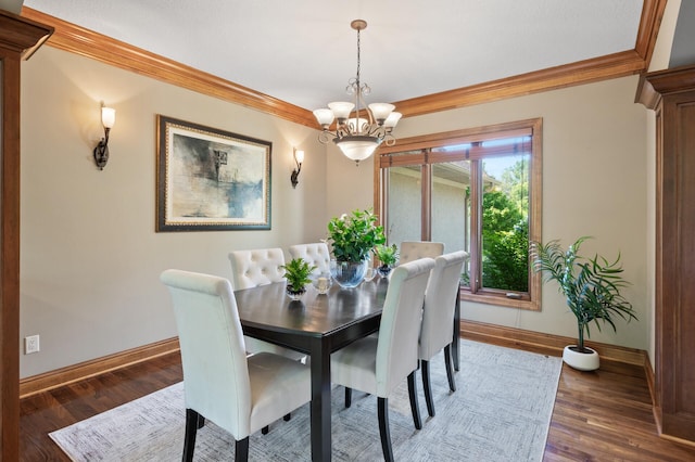 8867 Aviary Path, Inver Grove Heights, MN 55077 - dining area featuring baseboards, ornamental molding, a chandelier, and wood finished floors