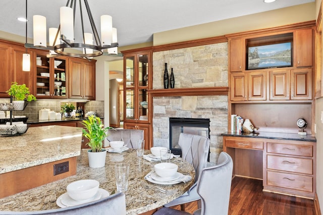 8867 Aviary Path, Inver Grove Heights, MN 55077 - dining space featuring dark wood finished floors, a fireplace, and recessed lighting
