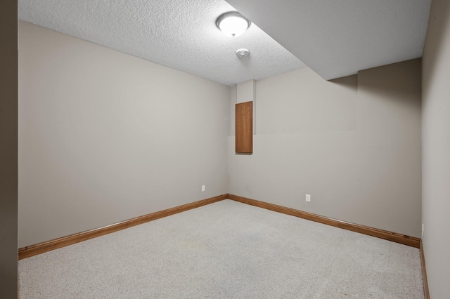 8867 Aviary Path, Inver Grove Heights, MN 55077 - spare room with carpet flooring, baseboards, a textured ceiling, and a smoke detector