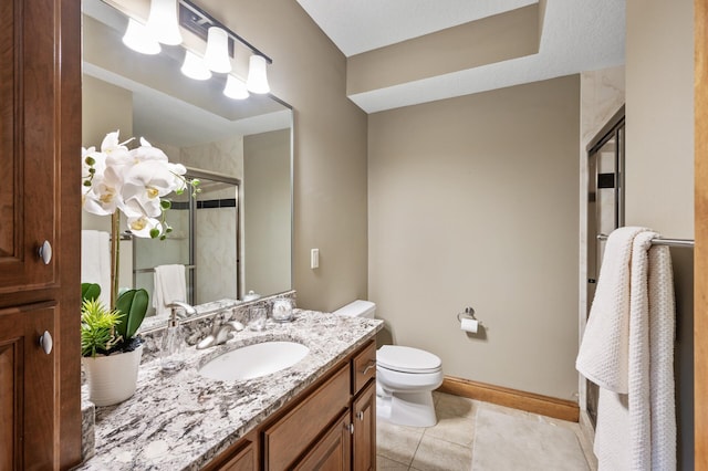 8867 Aviary Path, Inver Grove Heights, MN 55077 - full bath with toilet, a shower with door, vanity, tile patterned flooring, and baseboards