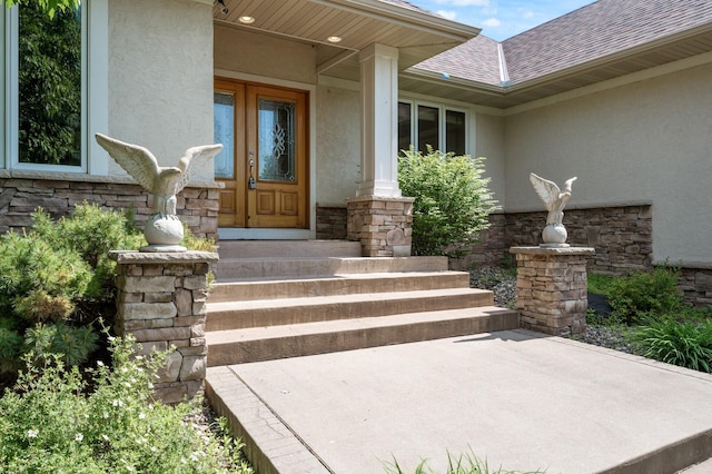 8867 Aviary Path, Inver Grove Heights, MN 55077 - entrance to property featuring stucco siding, stone siding, a shingled roof, and french doors