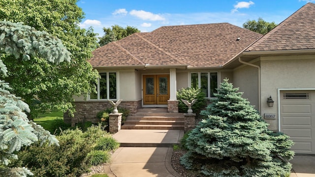 8867 Aviary Path, Inver Grove Heights, MN 55077 - doorway to property featuring stucco siding, french doors, and a shingled roof