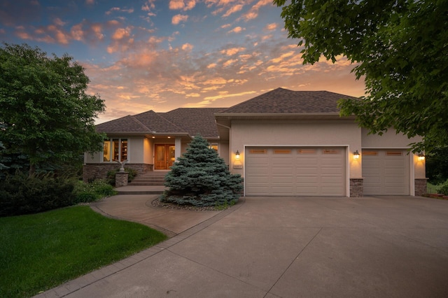 8867 Aviary Path, Inver Grove Heights, MN 55077 - view of front of home featuring stone siding, stucco siding, concrete driveway, and a garage