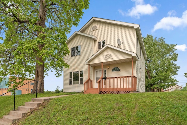 2524 Bryant Ave N, Minneapolis, MN 55411 - traditional-style home with a front lawn and a wooden deck