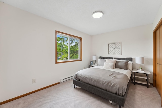 2524 Bryant Ave N, Minneapolis, MN 55411 - bedroom with a baseboard radiator, carpet flooring, and baseboards