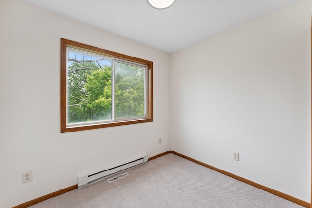 2524 Bryant Ave N, Minneapolis, MN 55411 - unfurnished room with baseboard heating, baseboards, and light carpet