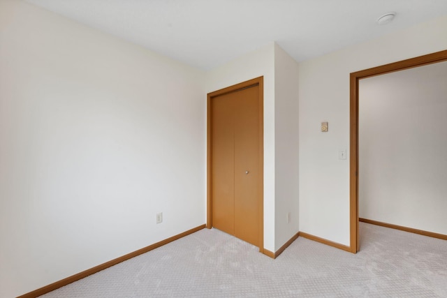 2524 Bryant Ave N, Minneapolis, MN 55411 - unfurnished bedroom with carpet floors, baseboards, and a closet