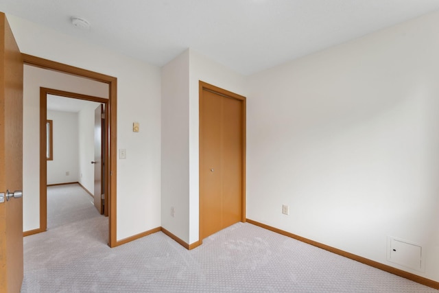 2524 Bryant Ave N, Minneapolis, MN 55411 - carpeted empty room featuring baseboards