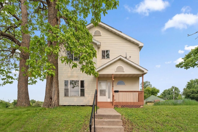 2524 Bryant Ave N, Minneapolis, MN 55411 - view of front facade featuring a front lawn and covered porch