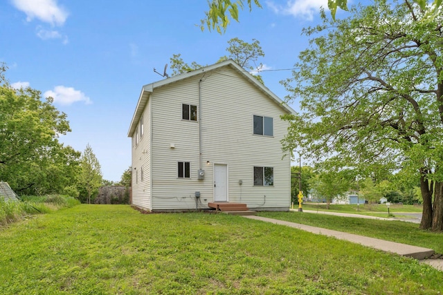 2524 Bryant Ave N, Minneapolis, MN 55411 - rear view of property featuring a lawn
