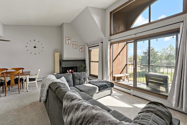 9700 Portland Ave S Unit 334, Bloomington, MN 55420 - living room featuring carpet floors, healthy amount of natural light, a brick fireplace, and high vaulted ceiling