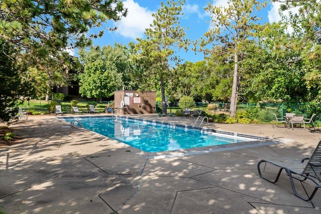 9700 Portland Ave S Unit 334, Bloomington, MN 55420 - community pool featuring a patio and view of scattered trees