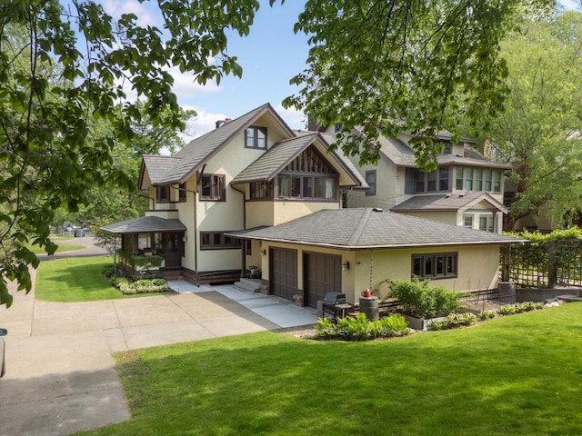 2022 Summit Ave, Saint Paul, MN 55105 - view of front facade featuring driveway, stucco siding, and a front yard
