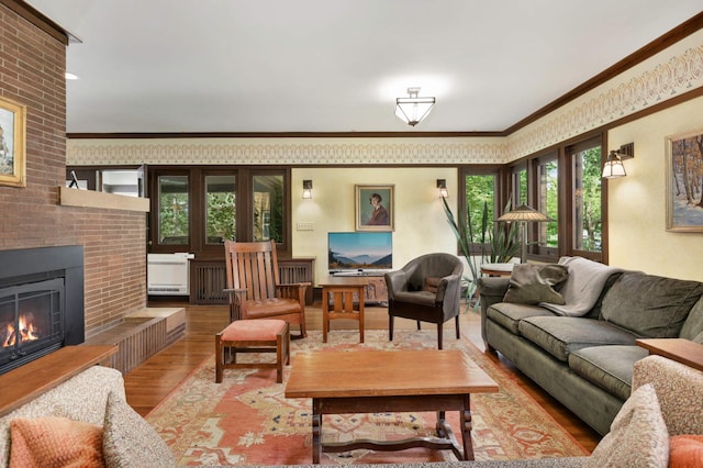 2022 Summit Ave, Saint Paul, MN 55105 - living area featuring wood finished floors, healthy amount of natural light, crown molding, and a fireplace