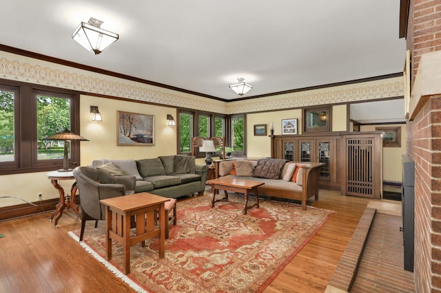 2022 Summit Ave, Saint Paul, MN 55105 - living area featuring healthy amount of natural light, hardwood / wood-style floors, ornamental molding, and baseboards