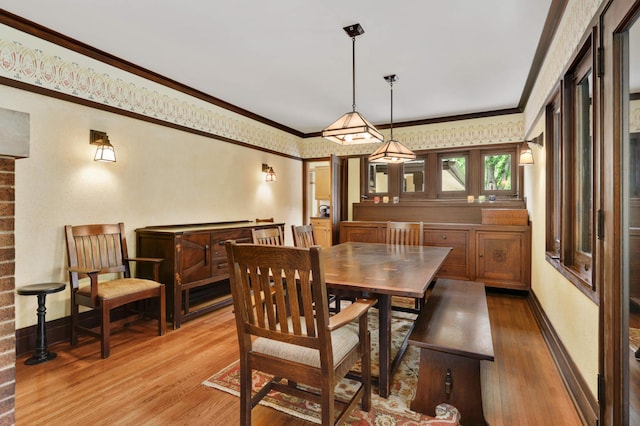2022 Summit Ave, Saint Paul, MN 55105 - dining space with light wood-type flooring, baseboards, and crown molding