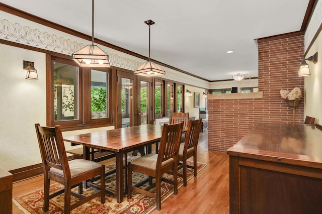 2022 Summit Ave, Saint Paul, MN 55105 - dining area with light wood finished floors and crown molding