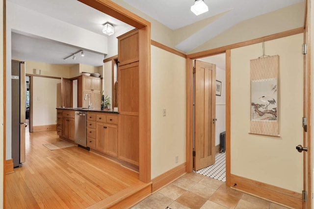 2022 Summit Ave, Saint Paul, MN 55105 - kitchen with appliances with stainless steel finishes, dark countertops, baseboards, a sink, and vaulted ceiling