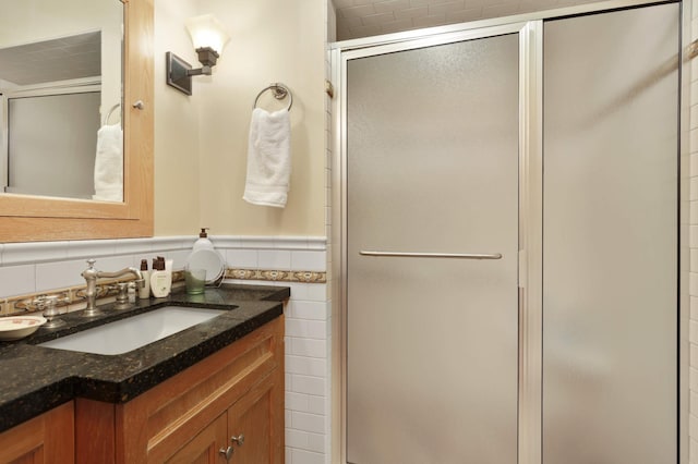 2022 Summit Ave, Saint Paul, MN 55105 - bathroom featuring vanity, a stall shower, a wainscoted wall, and tile walls