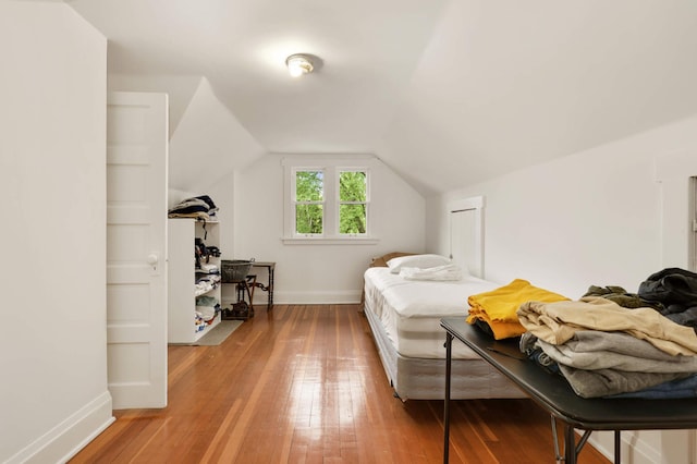 2022 Summit Ave, Saint Paul, MN 55105 - bedroom with baseboards, light wood-style flooring, and lofted ceiling