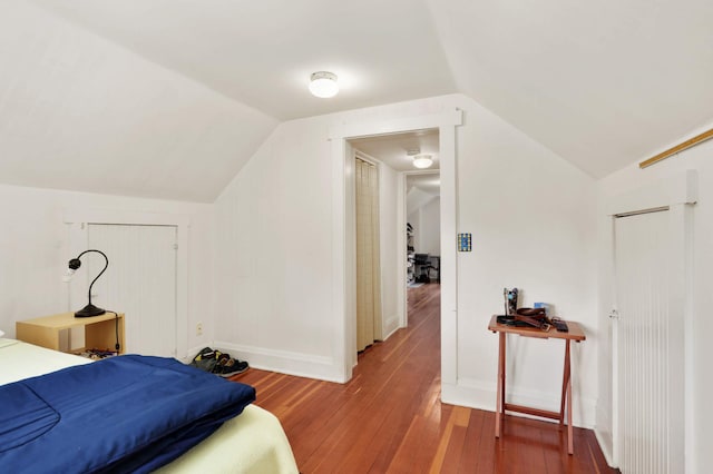 2022 Summit Ave, Saint Paul, MN 55105 - bedroom with lofted ceiling, wood-type flooring, and baseboards