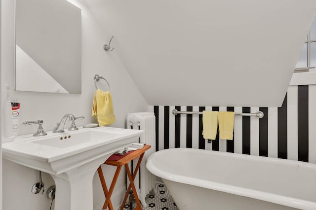 2022 Summit Ave, Saint Paul, MN 55105 - bathroom with a freestanding bath, a sink, and vaulted ceiling