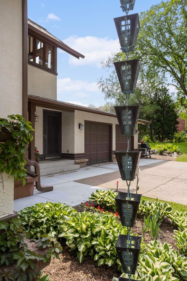 2022 Summit Ave, Saint Paul, MN 55105 - property entrance with stucco siding and a garage