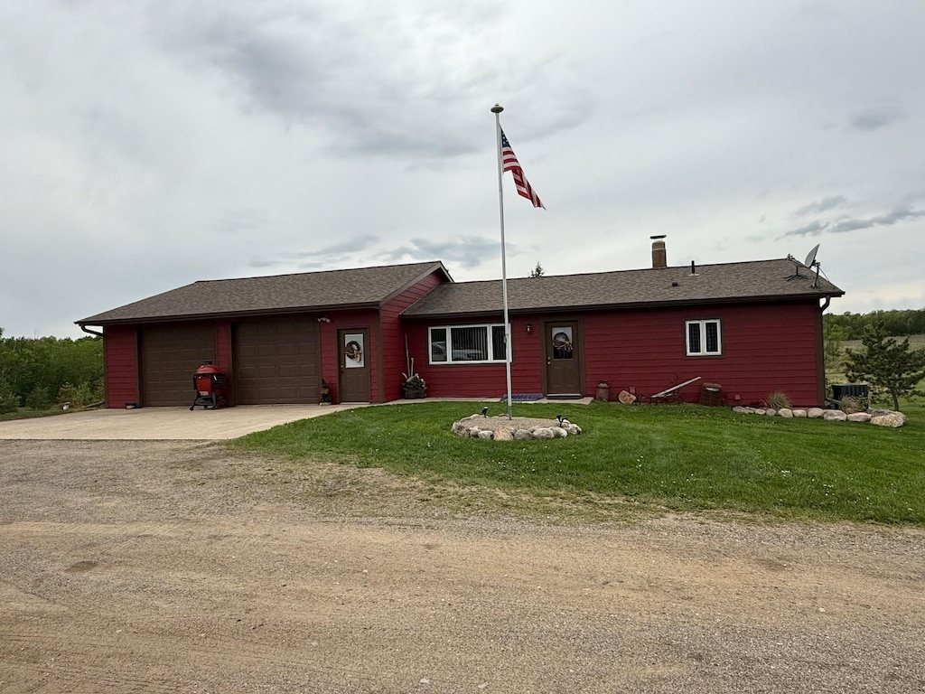 8059 29th Ave SW, Pequot Lakes, MN 56472 - single story home with a garage, concrete driveway, a front yard, central AC, and a chimney