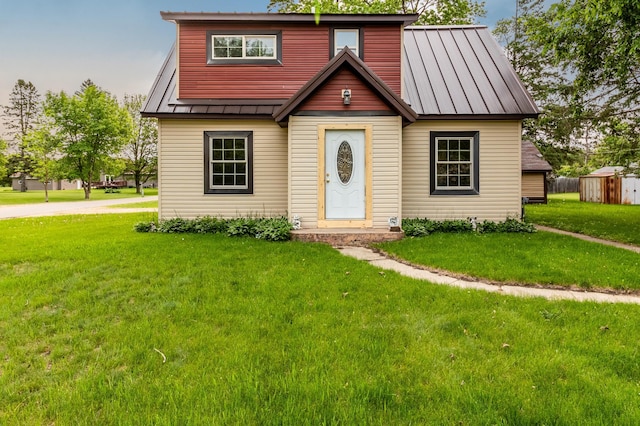 407 John St N, Clarissa, MN 56440 - view of front of home with a standing seam roof, a front yard, and metal roof