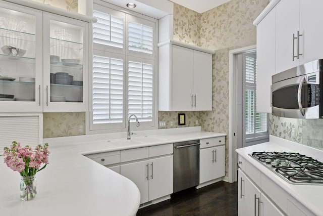 3490 Fairway Ln, Minnetonka, MN 55305 - kitchen featuring stainless steel appliances, wallpapered walls, plenty of natural light, and a sink